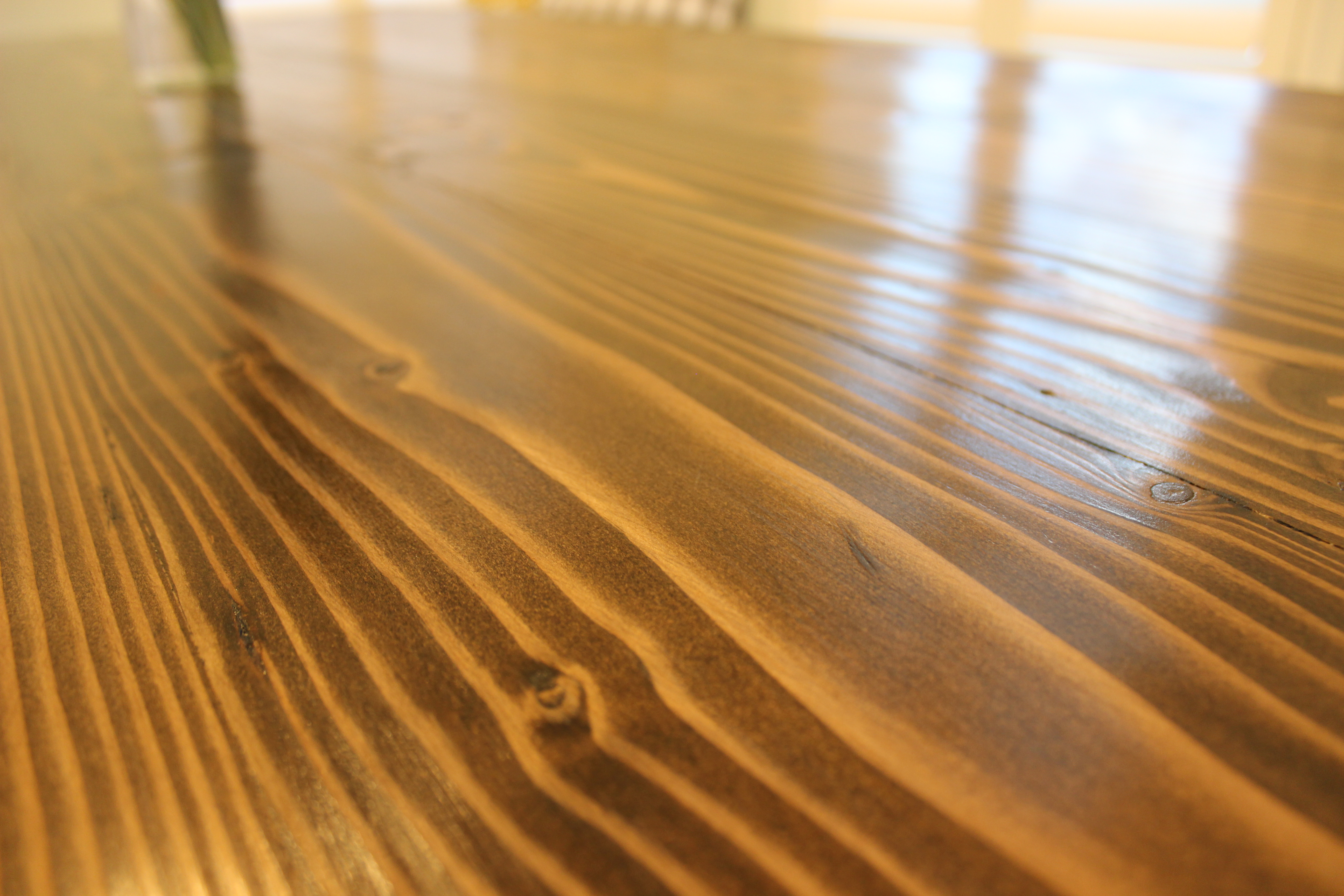 Up-close shot of wood grain of dining table