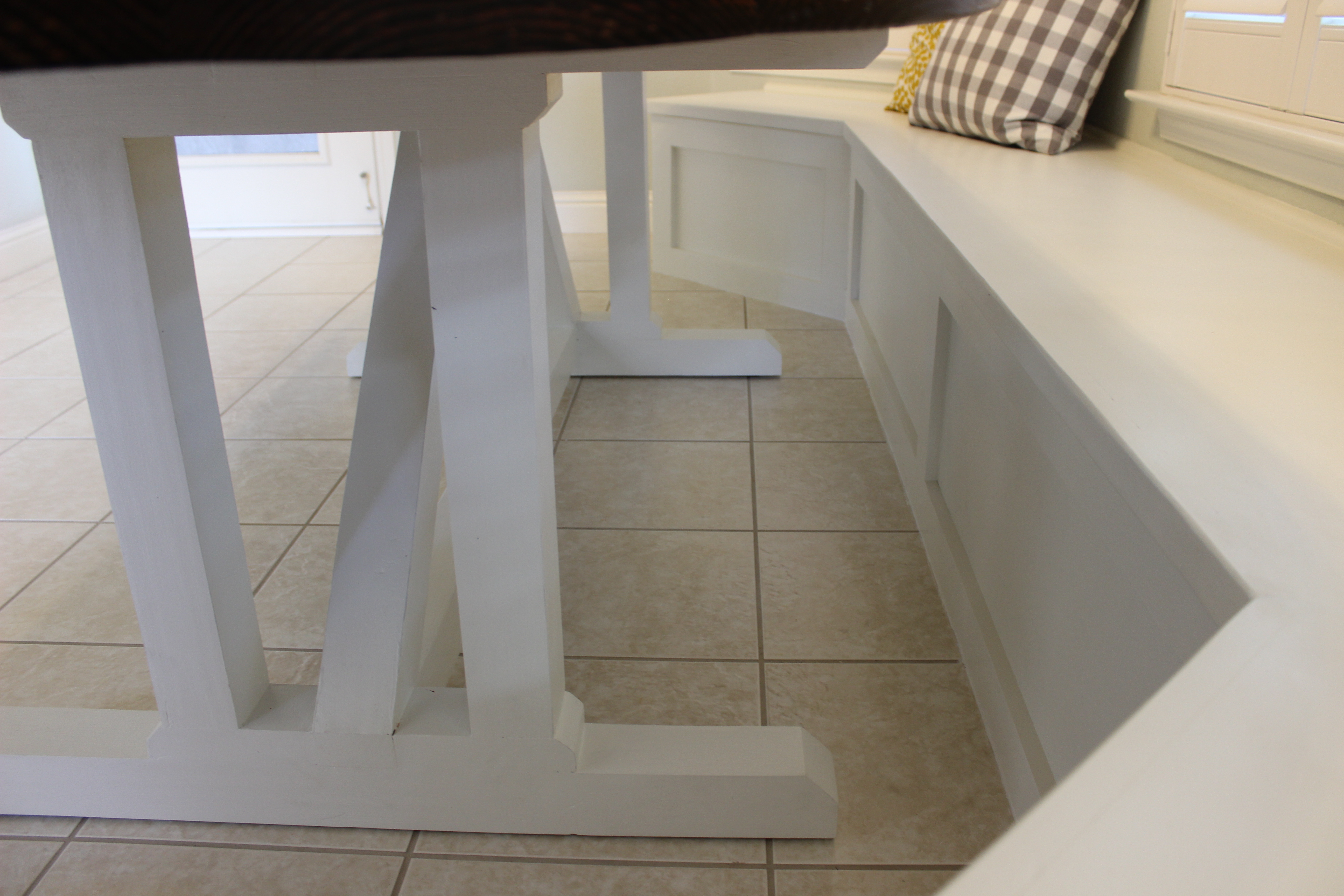 view of finished table base next to banquette seating