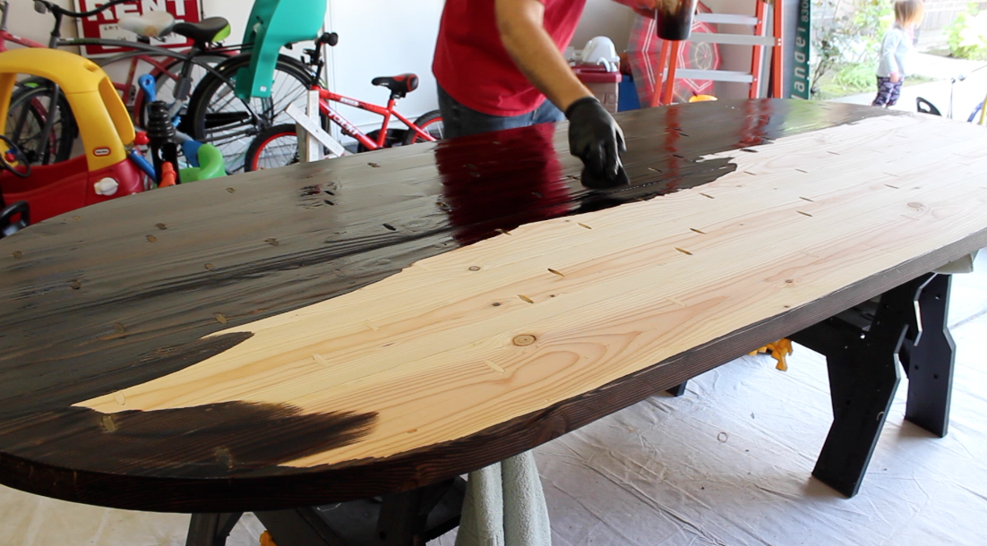 Applying walnut stain to bare wood table top