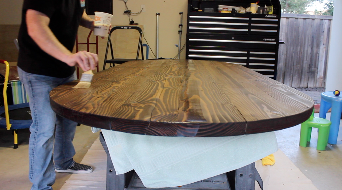 Applying polyurethane finish to wood table top