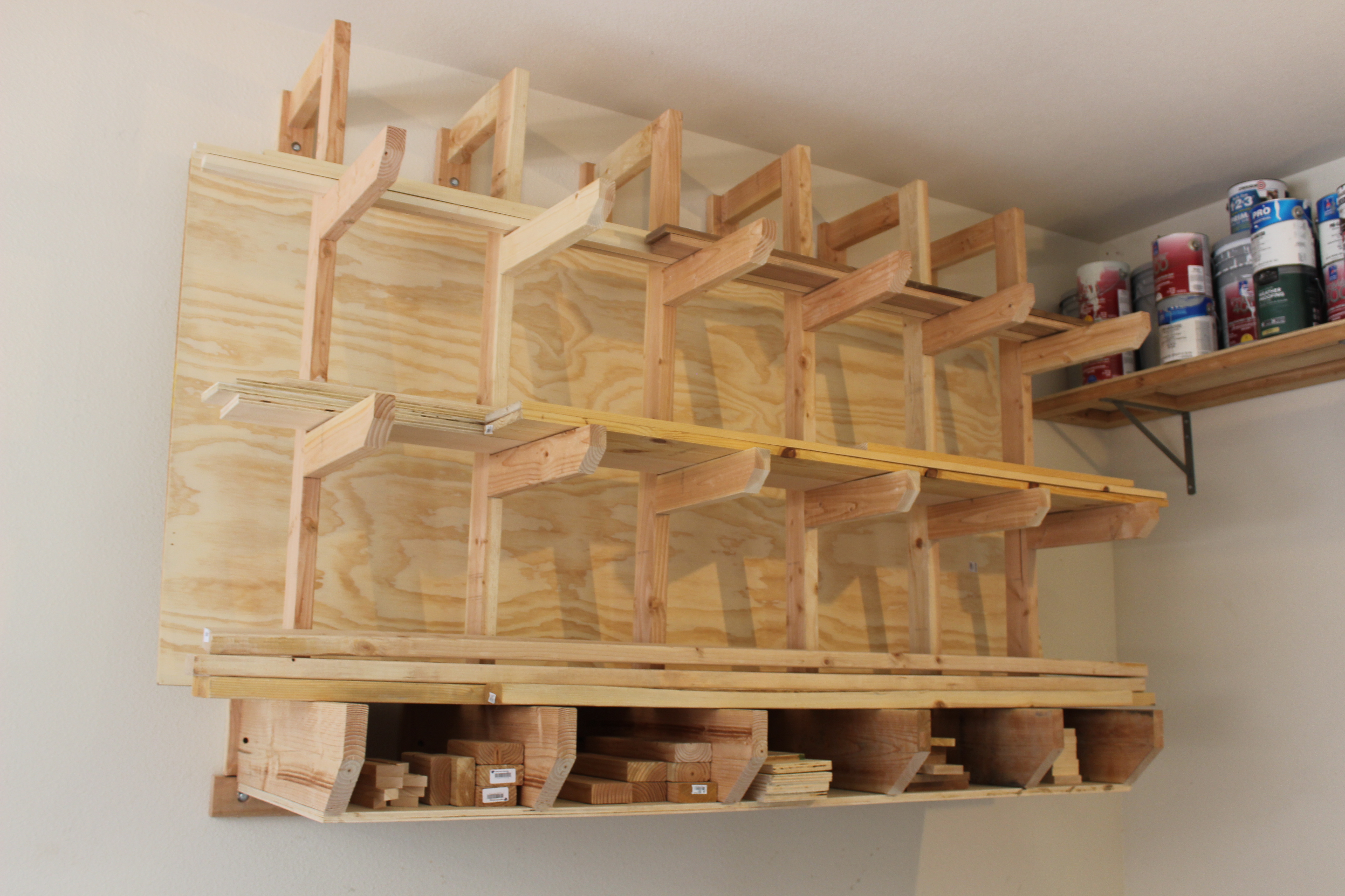 wall-mount lumber rack full of wood