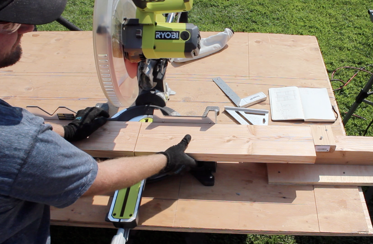 Cutting legs of the workbench with a miter saw