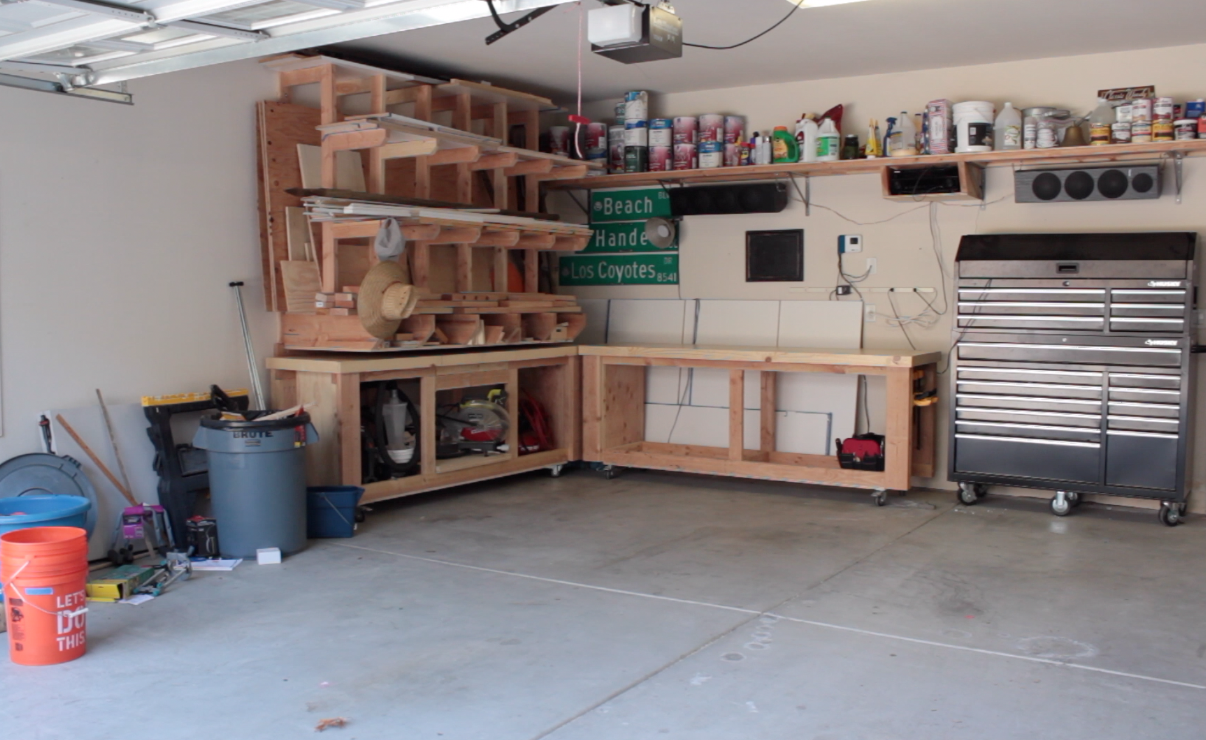 workbenches stored in the corner of the garage