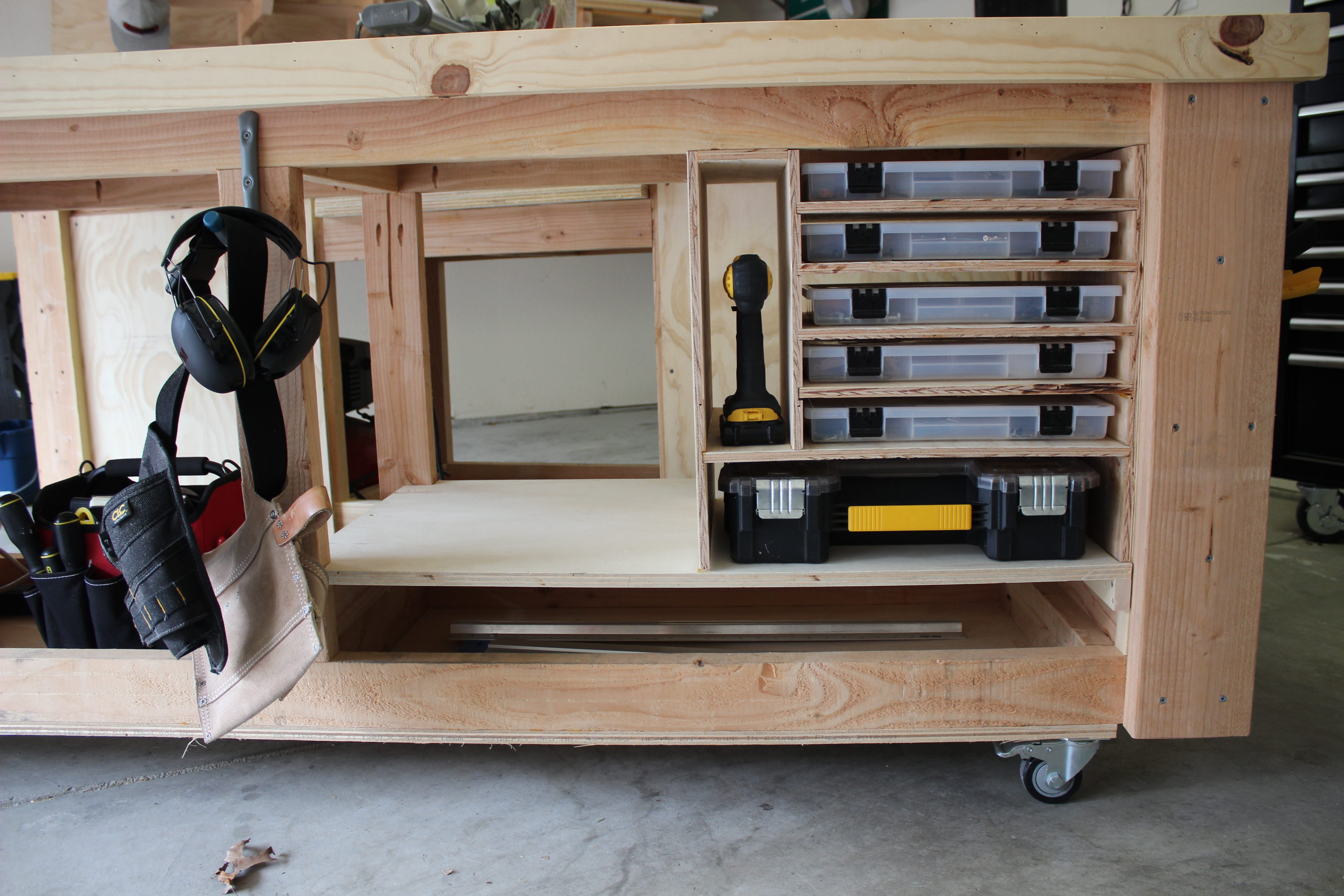 extra storage for screws and tools made out of plywood shelves