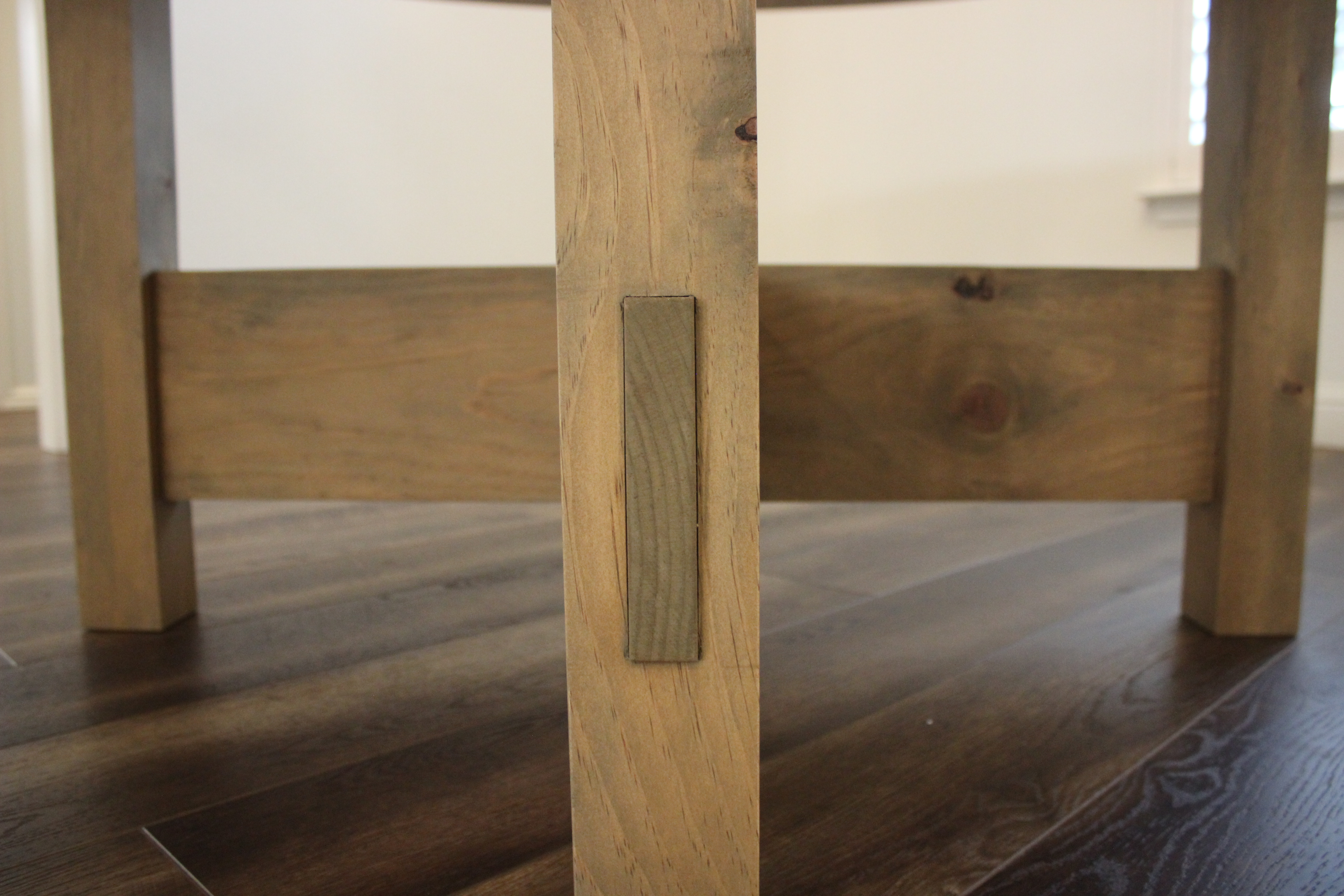 close up of through tenons in table legs