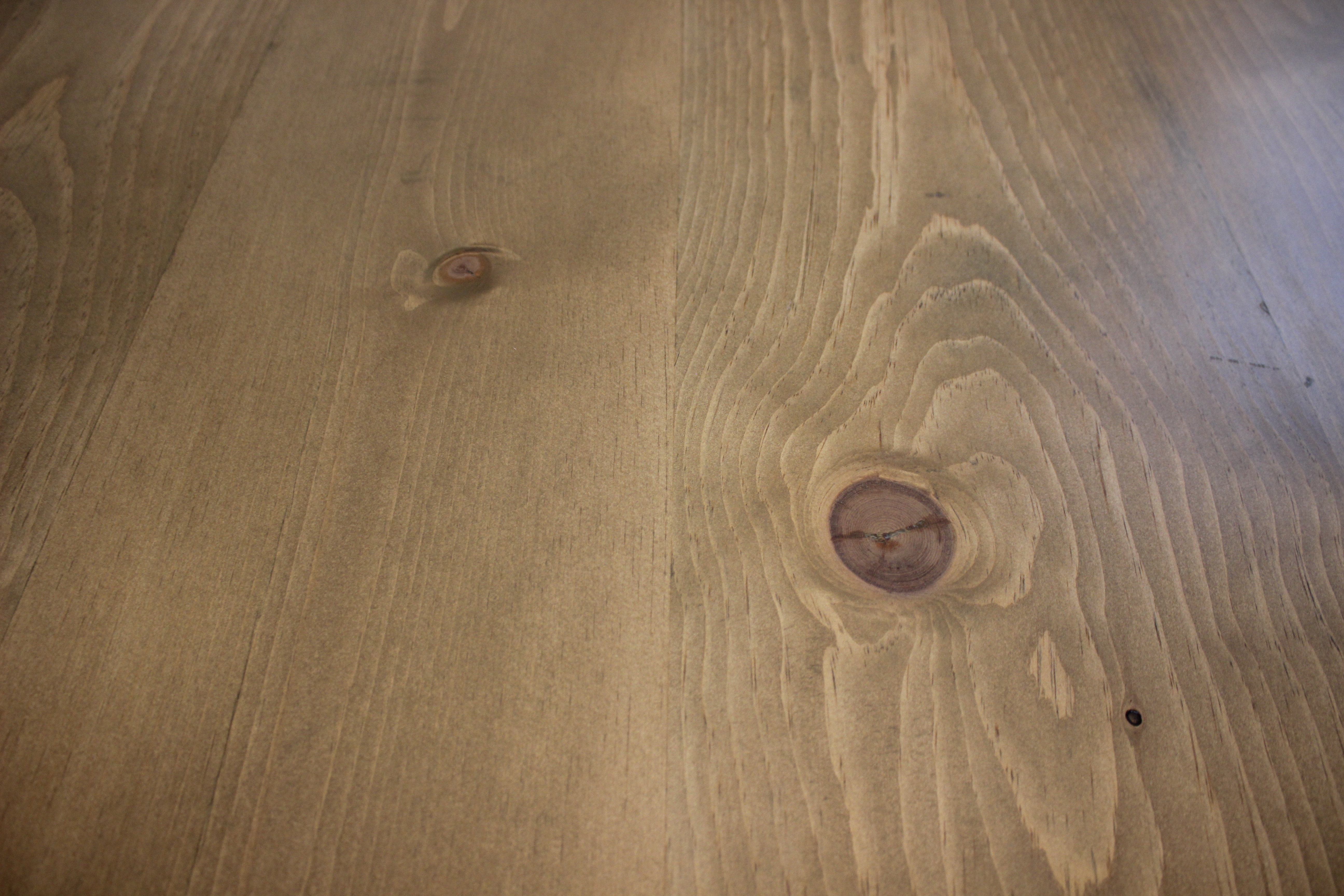 close-up of pine wood and stain on table top